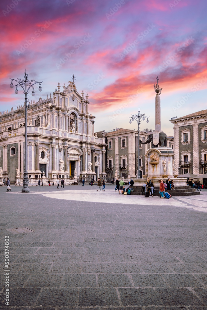 Piazza Duomo of Catania with its cathedral and the elephant fountain, symbols of the city, during a sunset