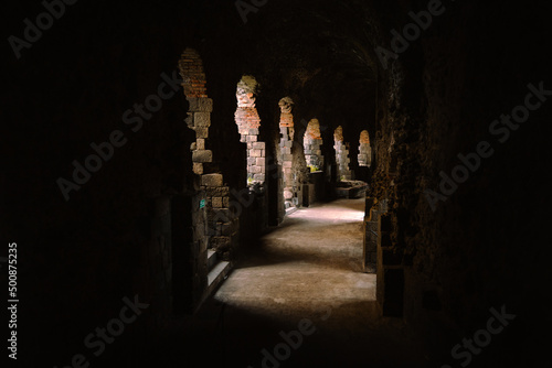 Roman amphitheater arcades of Catania illuminated by light