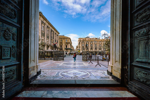 Entrance of the Cathedral of Catania with person entering