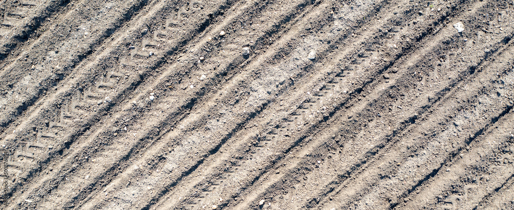 Banner of clear plowed field with traces. View from the top. Banner of clear plowed field with traces. View from the top.