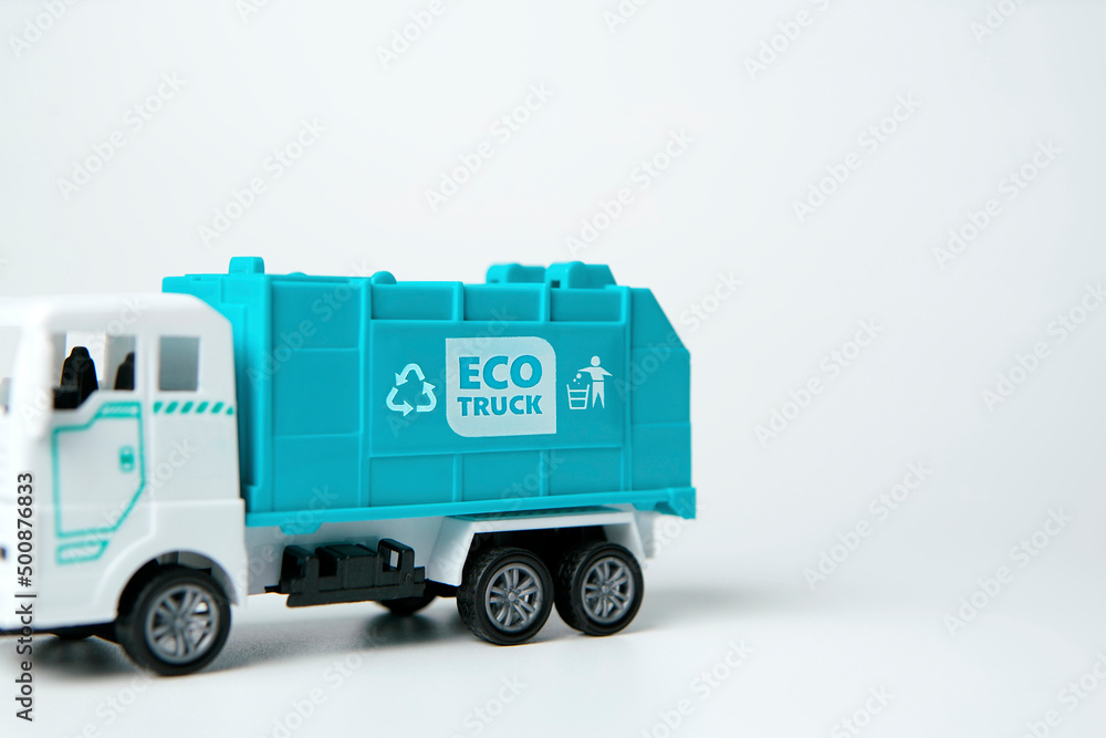 Close up  Trucks model with logo Eco truck and recycle bin symbol on white background, friendly with environment                                           