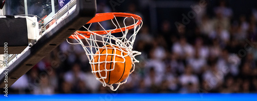 basketball game ball in hoop photo