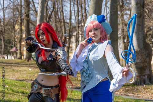 two women as cosplay figures in a forest photo