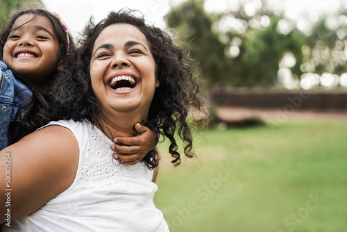 Fotografie, Obraz Happy indian mother having fun with her daughter outdoor - Mum day concept - Foc