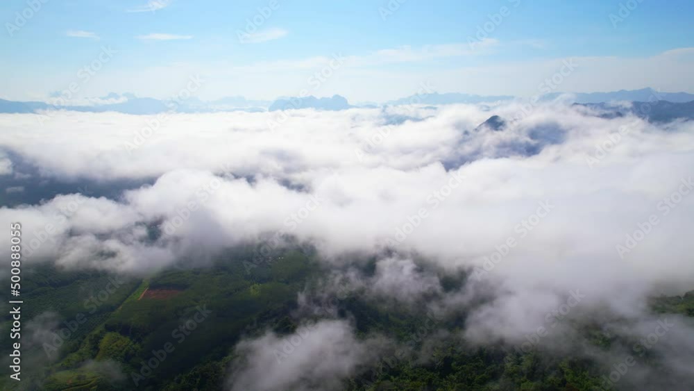 An aerial view from a drone flying over the many fogs in the mountains. wonderful morning sunrise natural Landscape. Khao sok National Park, Surat Thani, Thailand. 4K
An aerial view from a drone flying over the many fogs in the mountains. wonderful morning sunrise natural Landscape. Khao sok National Park, Surat Thani, Thailand. 4K