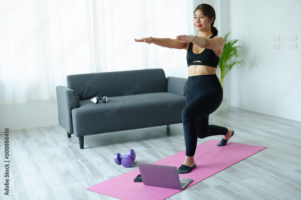 stress relief, muscle relaxation, breathing exercises, exercise, meditation, portrait of Young Asian woman relaxing her body from office work by practicing yoga by watching online tutorials. stress relief, muscle relaxation, breathing exercises, exercise, meditation, portrait of Young Asian woman relaxing her body from office work by practicing yoga by watching online tutorials.