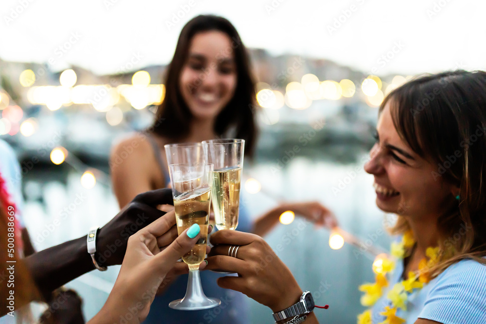 Summer lifestyle concept with young multiracial people cheering on boat party - Diverse friends having fun together drinking alcohol celebrating birthday - Focus on bottles Summer lifestyle concept with young multiracial people cheering on boat party - Diverse friends having fun together drinking alcohol celebrating birthday - Focus on bottles