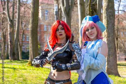 two women as cosplay figures in a forest