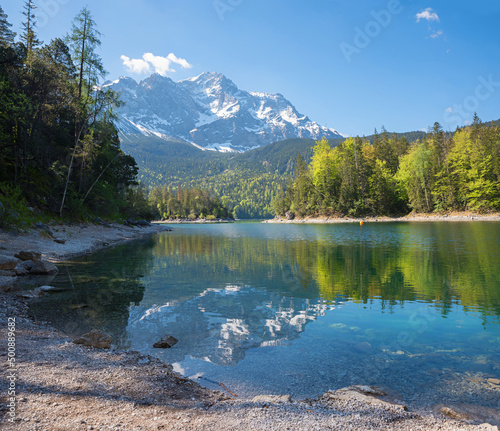 lake Eibsee and Zugspitze mountain, reflecting in the water, spring landscape upper bavaria.