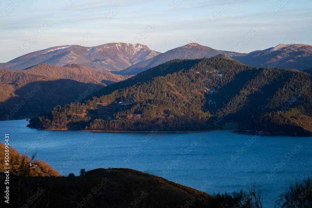 Sunset over mountains at Riaño reservoir in Spain