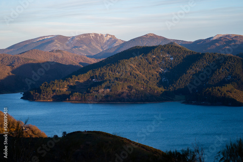 Sunset over mountains at Riaño reservoir in Spain