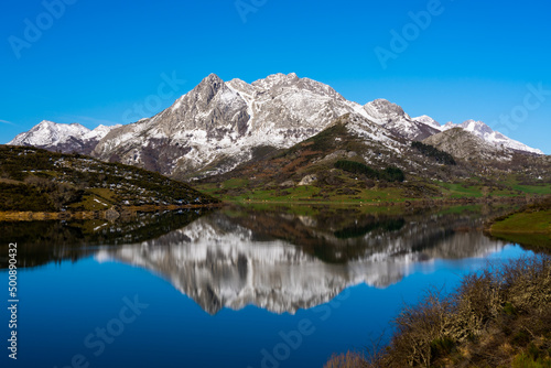 Winter Morning and reflection of  mountains at Ria  o reservoir in Spain
