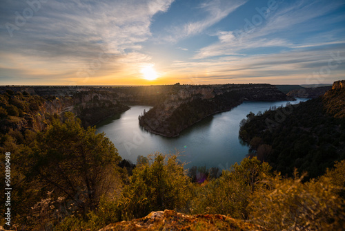 Sunset landscape  canyoned river with green trees. Hoces Duraton River.