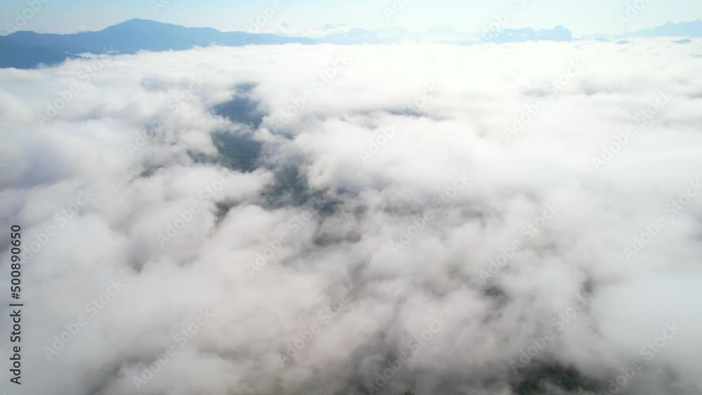 4K aerial view from a drone flying over the valley, fog in the morning. bright weather and amazing nature landscape. Khao sok National Park, Surat Thani, Thailand. 4K
4K aerial view from a drone flying over the valley, fog in the morning. bright weather and amazing nature landscape. Khao sok National Park, Surat Thani, Thailand. 4K