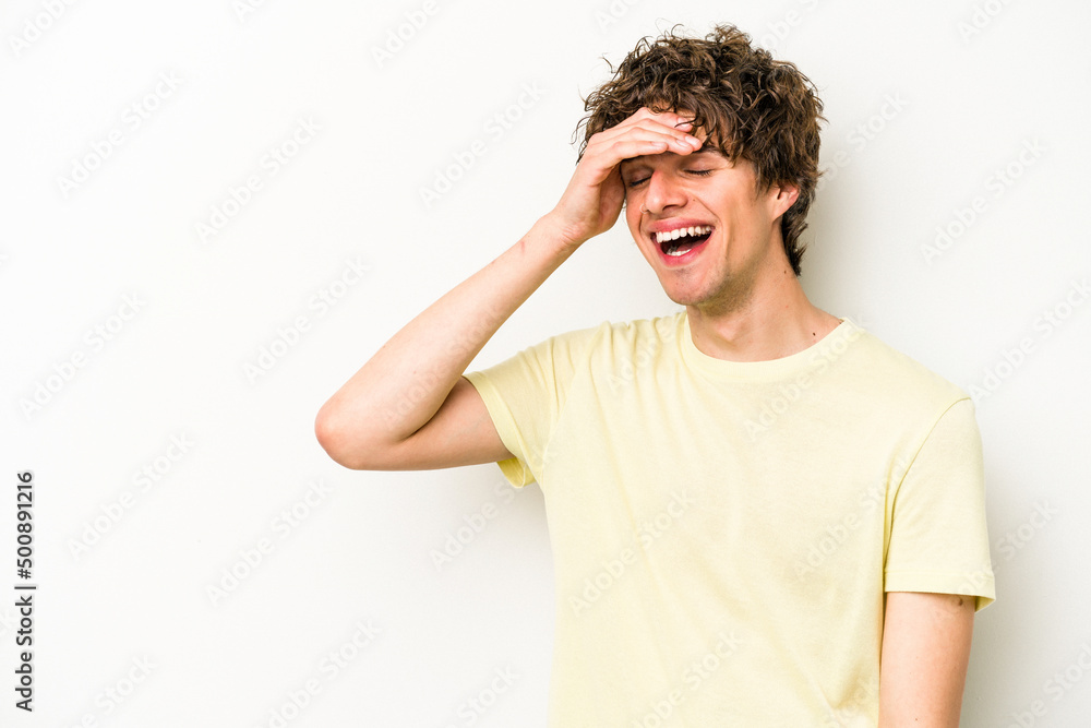 Young caucasian man isolated on white background laughing happy, carefree, natural emotion. Young caucasian man isolated on white background laughing happy, carefree, natural emotion.