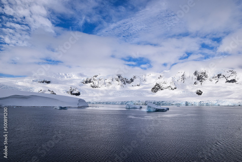 ice and snow covered coast at antarctic peninsula  Antarctica