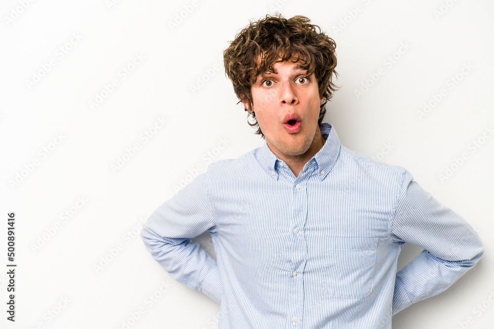 Young caucasian man isolated on white background being shocked because of something she has seen. Young caucasian man isolated on white background being shocked because of something she has seen.