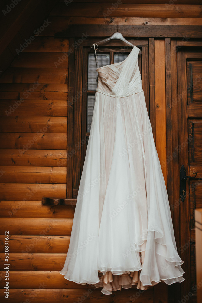 Beautiful wedding dress on a hanger stock photo. Beautiful wedding dress on a hanger stock photo.