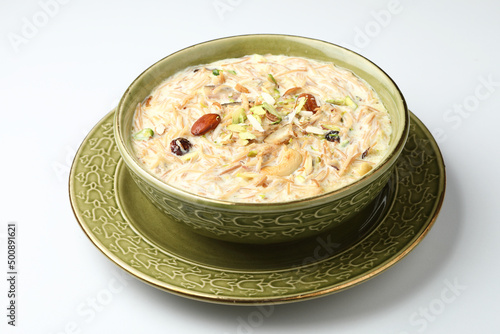 Khir or kheer payasam also known as Sheer Khurma Seviyan consumed especially on Eid or any other festival in india/asia. Served with dry fruits toppings selective focus 