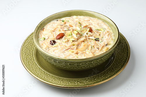 Khir or kheer payasam also known as Sheer Khurma Seviyan consumed especially on Eid or any other festival in india/asia. Served with dry fruits toppings selective focus  photo