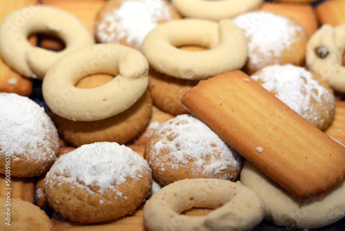 Traditional Arabic cookies for celebration of Islamic holidays of El-Fitr feast, Egyptian Kahk covered with powdered sugar and stuffed with walnuts, Eid biscuit and Ghoriba that is made with ghee photo