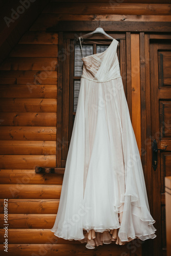 Beautiful wedding dress on a hanger stock photo. © Tobica