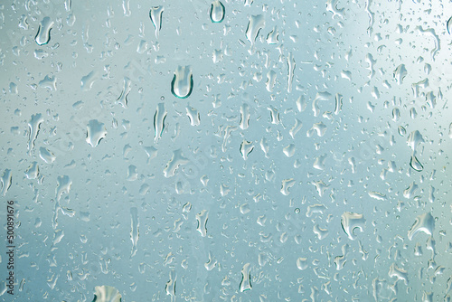 selective focus of rain drop on glass window. 