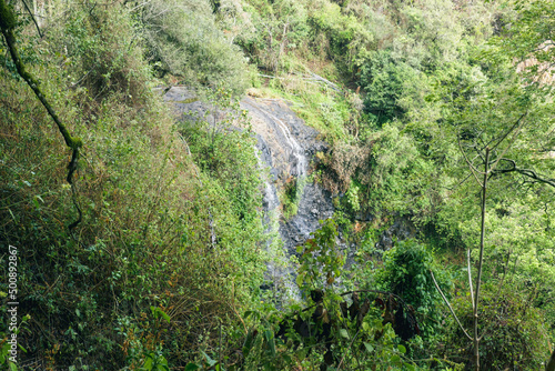 Scenic view of Kipkaren Waterfall in the forest at Elgeyo Marakwet County, Kenya photo