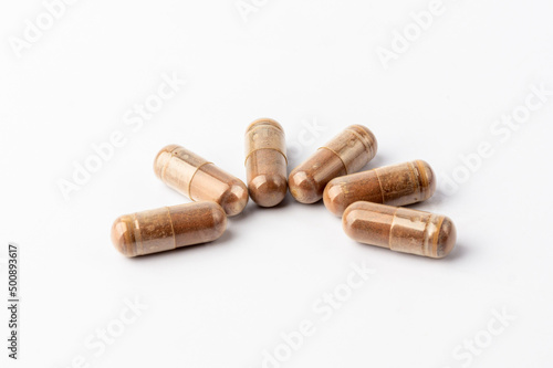 Grape Extract powder capsule on white background