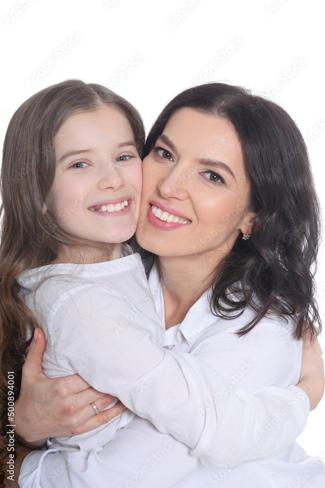 Portrait of happy mother and daughter posing on white background Portrait of happy mother and daughter posing on white background