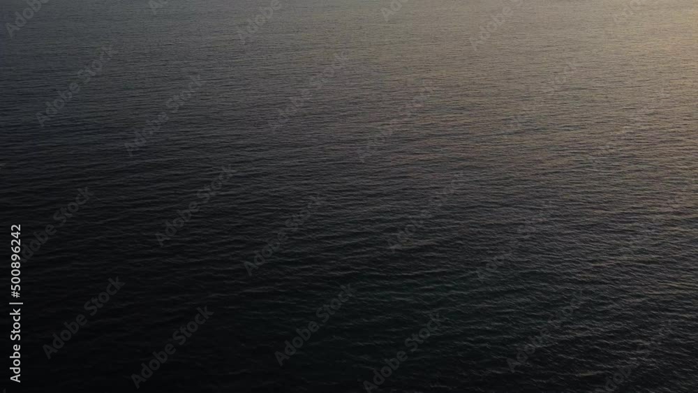 Arial shot of an ocean surface in sunset. Arial shot of an ocean surface in sunset.