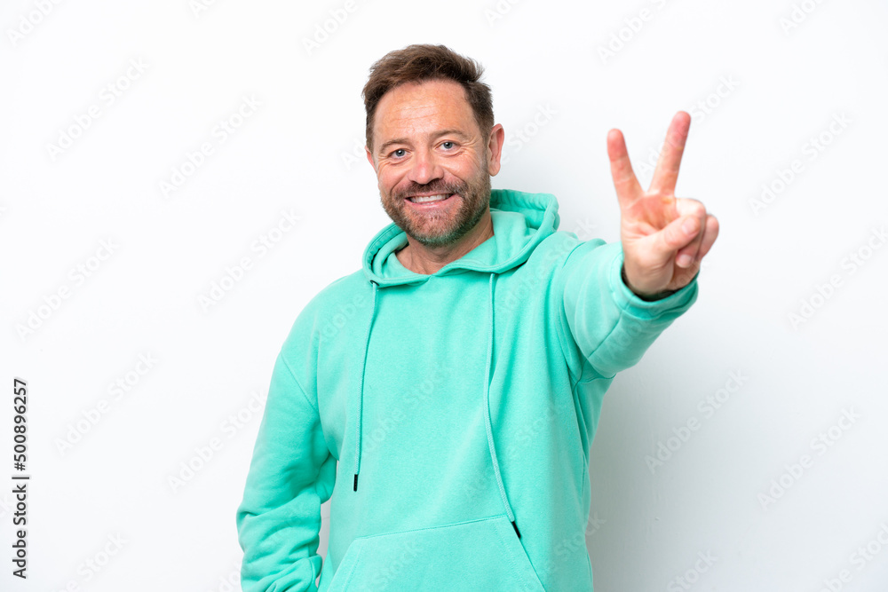 Middle age caucasian man isolated on white background smiling and showing victory sign Middle age caucasian man isolated on white background smiling and showing victory sign