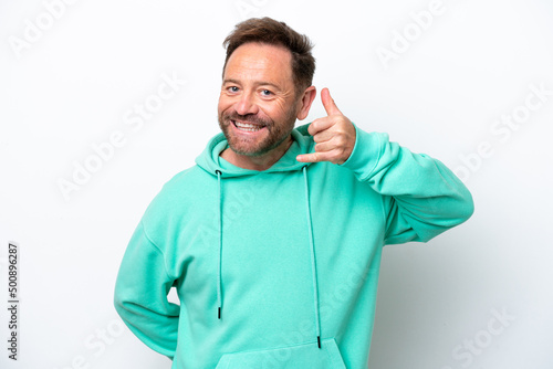 Middle age caucasian man isolated on white background making phone gesture. Call me back sign © luismolinero