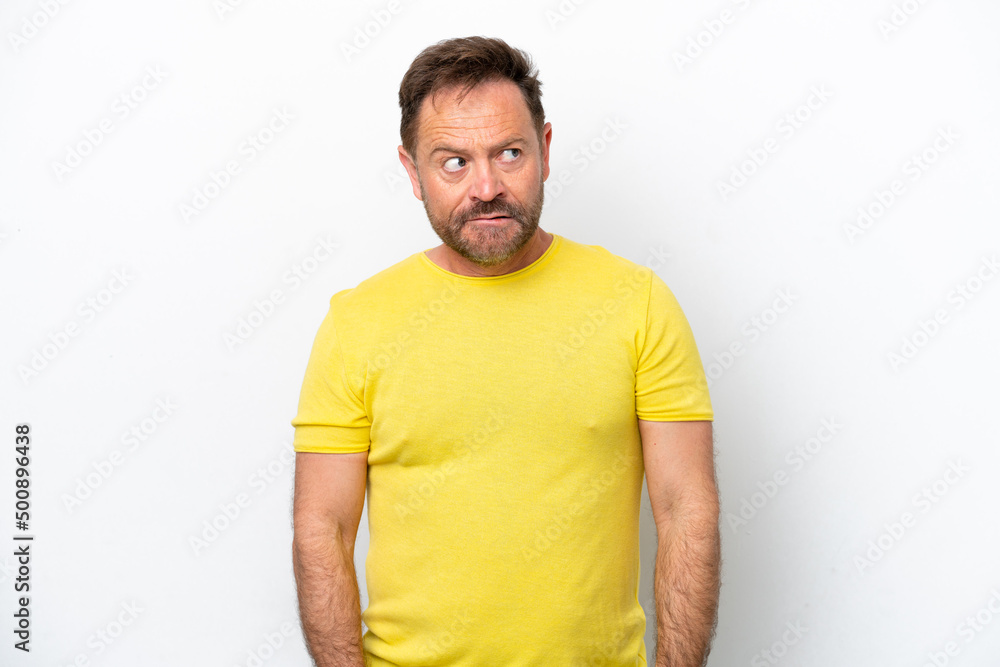Middle age caucasian man isolated on white background having doubts while looking up Middle age caucasian man isolated on white background having doubts while looking up