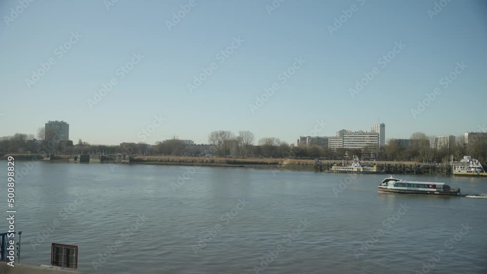 Antwerp River boat motoring up river in Belgium city 4k 60p Antwerp River boat motoring up river in Belgium city 4k 60p