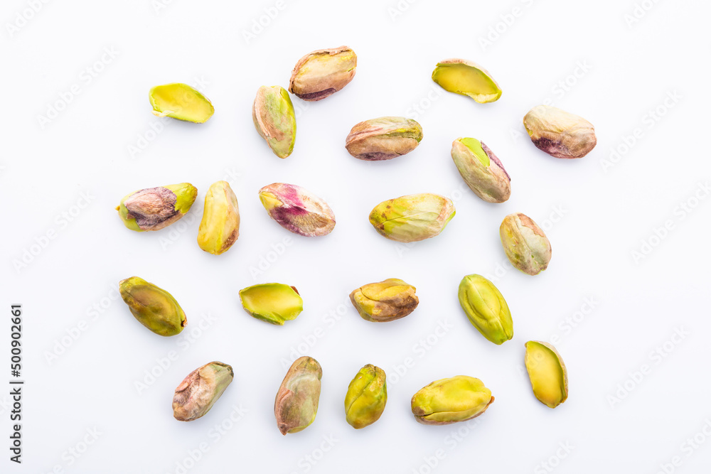 peeled pistachios on white background peeled pistachios on white background