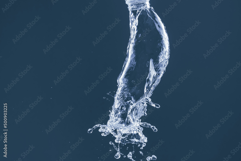 Water splash on a blue background. Reflection on the surface of the water. Water splash on a blue background. Reflection on the surface of the water.