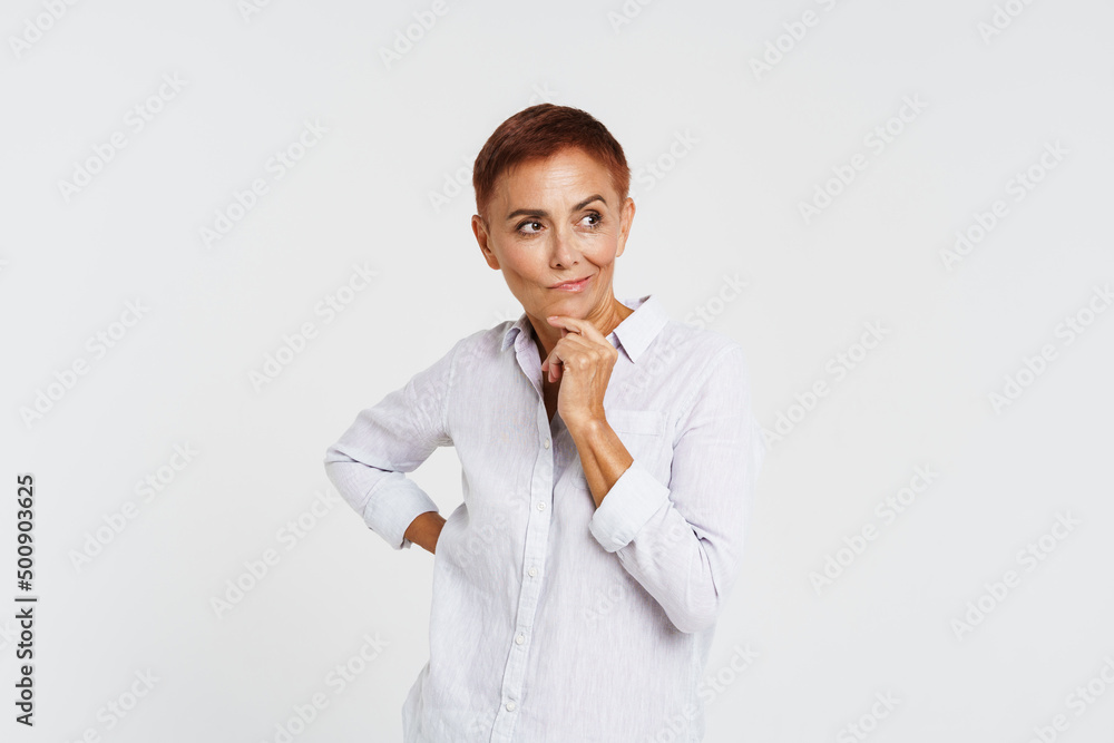 Ginger senior woman with short hair posing and looking aside Ginger senior woman with short hair posing and looking aside