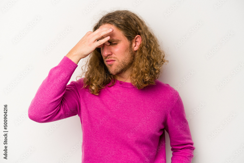 Young caucasian man isolated on white background having a head ache, touching front of the face. Young caucasian man isolated on white background having a head ache, touching front of the face.