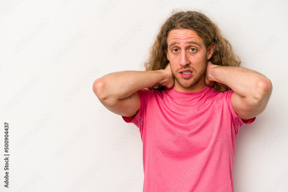 Young caucasian man isolated on white background touching back of head, thinking and making a choice. Young caucasian man isolated on white background touching back of head, thinking and making a choice.