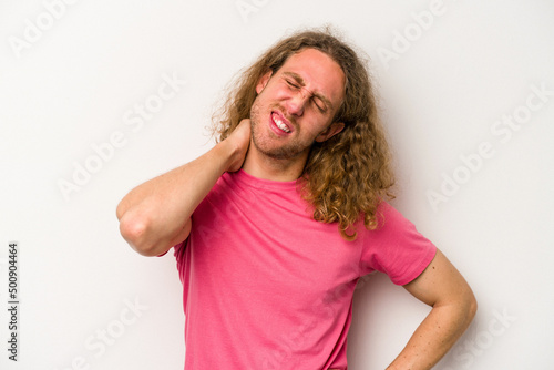 Young caucasian man isolated on white background suffering neck pain due to sedentary lifestyle.