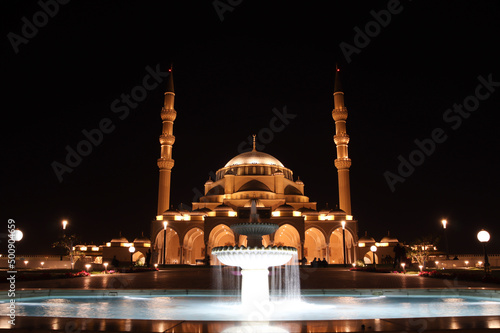 lighted up sharjah mosque in night , UAE