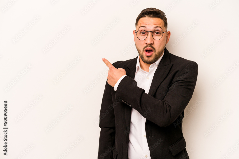 Business hispanic man isolated on white background pointing to the side Business hispanic man isolated on white background pointing to the side