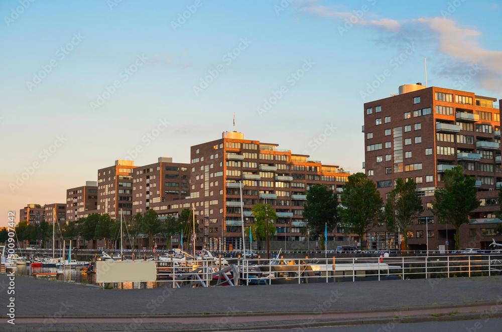 Beautiful cityscape with modern buildings near river Beautiful cityscape with modern buildings near river