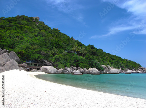 White sand beach, emerald clear andaman sea and bright blue sky
