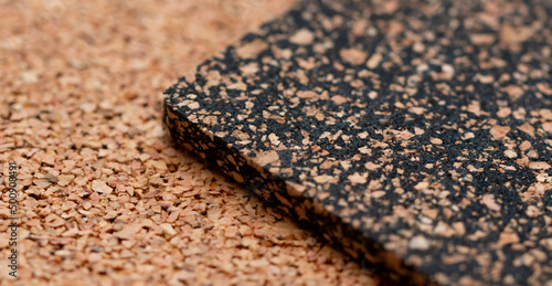 A close-up of a rubberized and rubberless cork plate with a shallow depth of field	