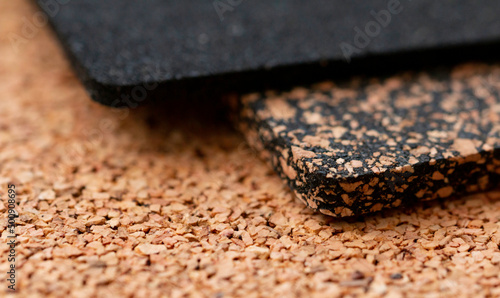 A close-up of a rubberized and rubberless cork plate with a shallow depth of field