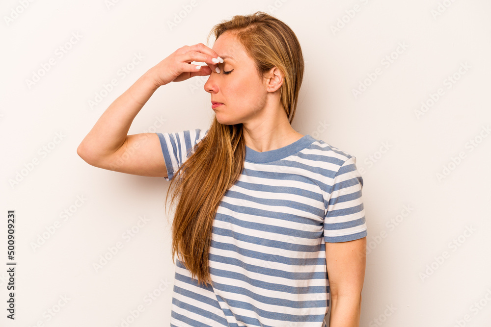Young caucasian woman isolated on white background having a head ache, touching front of the face. Young caucasian woman isolated on white background having a head ache, touching front of the face.