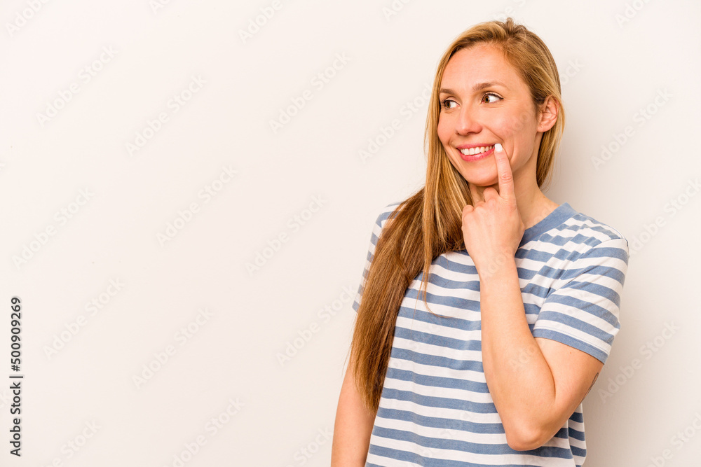 Young caucasian woman isolated on white background relaxed thinking about something looking at a copy space. Young caucasian woman isolated on white background relaxed thinking about something looking at a copy space.