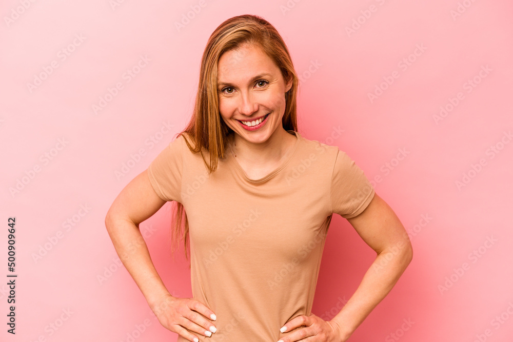 Obraz premium Young caucasian woman isolated on pink background happy, smiling and cheerful.